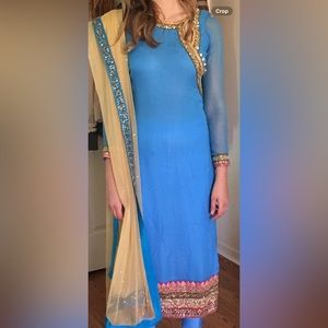 Blue kameez and net dupatta with embroidered neckline
